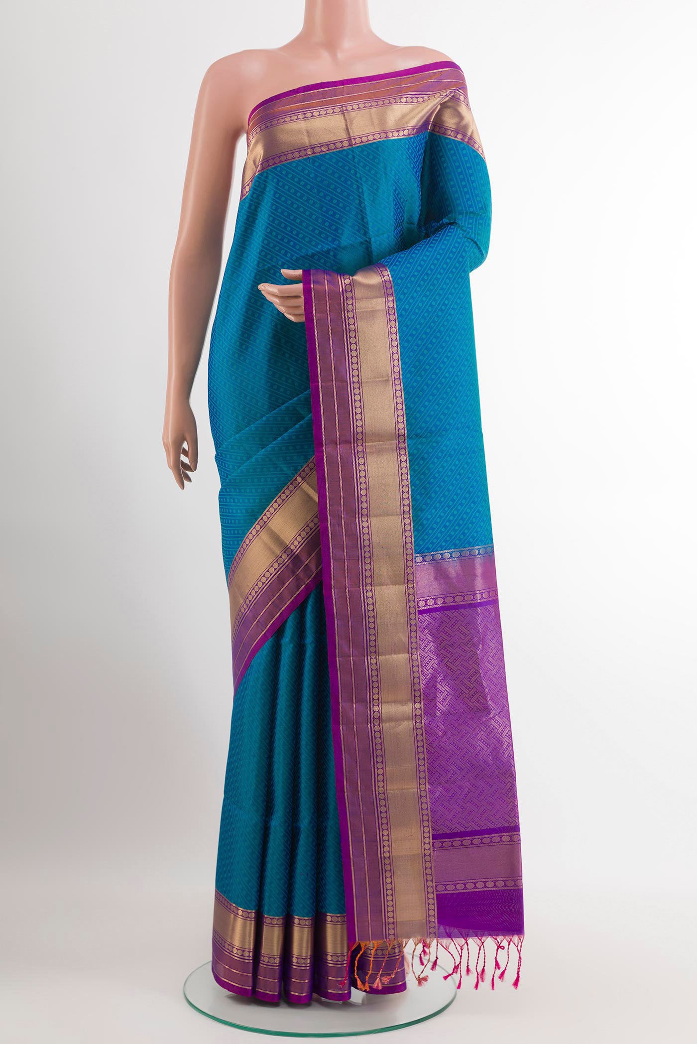 Blue Soft Silk Saree with Jacquard design on the body and Zari Border.  displayed on a mannequin