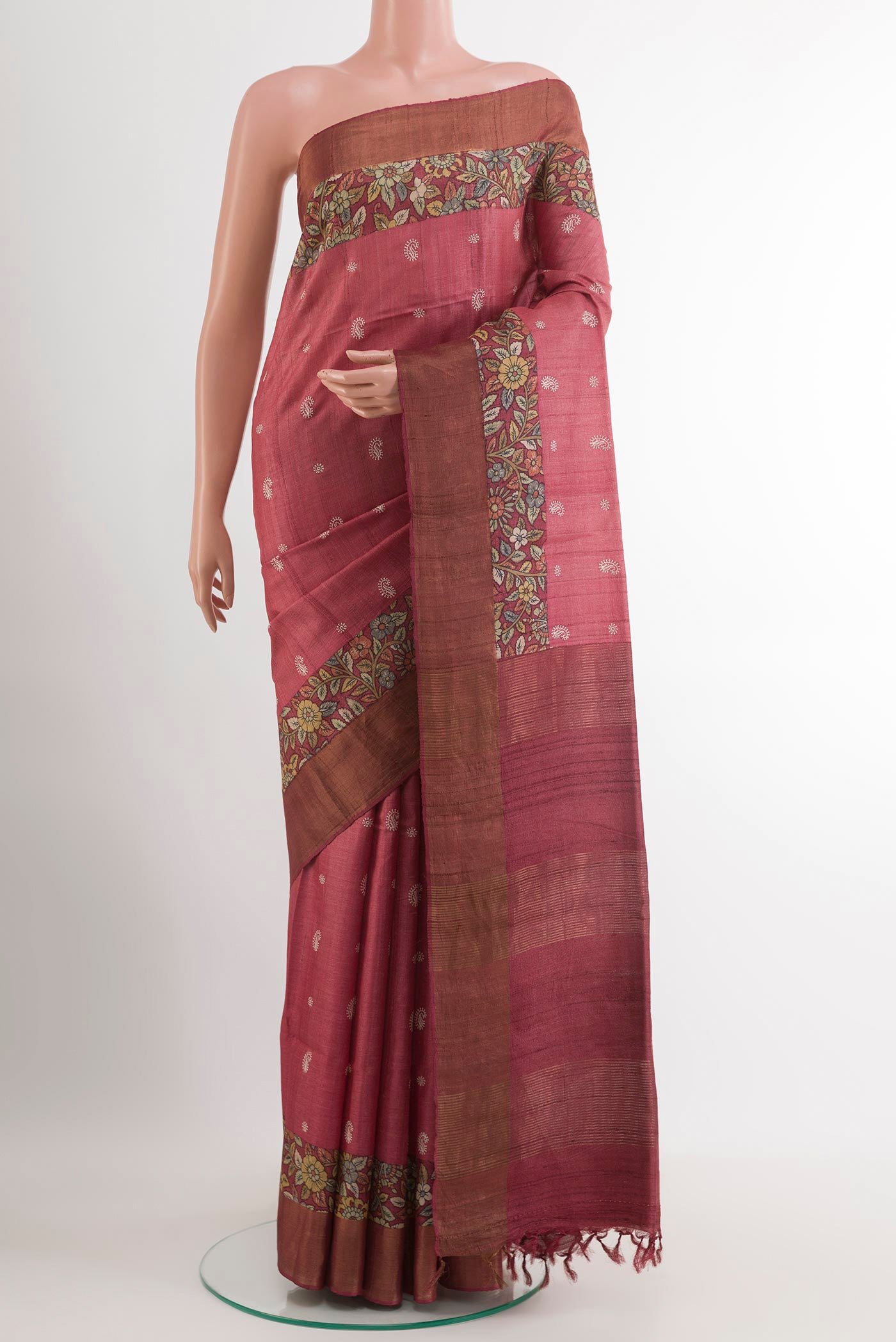 Maroon Tussar Saree with Thread Butta on the body and Zari Border.  displayed on a mannequin