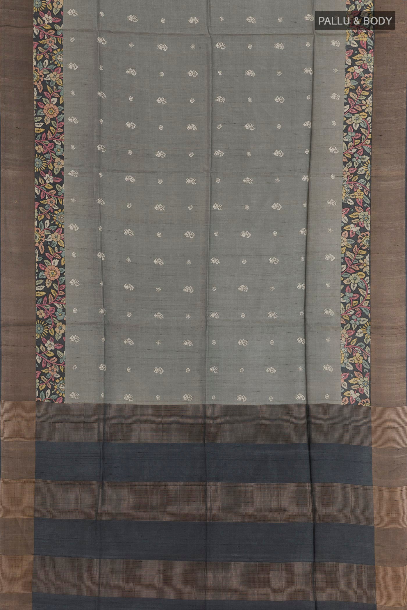 Flat view of Grey Tussar Saree with Thread Butta on the body and Zari Border. 