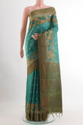 Sea Green Tussar Saree with Thread Butta on the body and Zari Border.  displayed on a mannequin