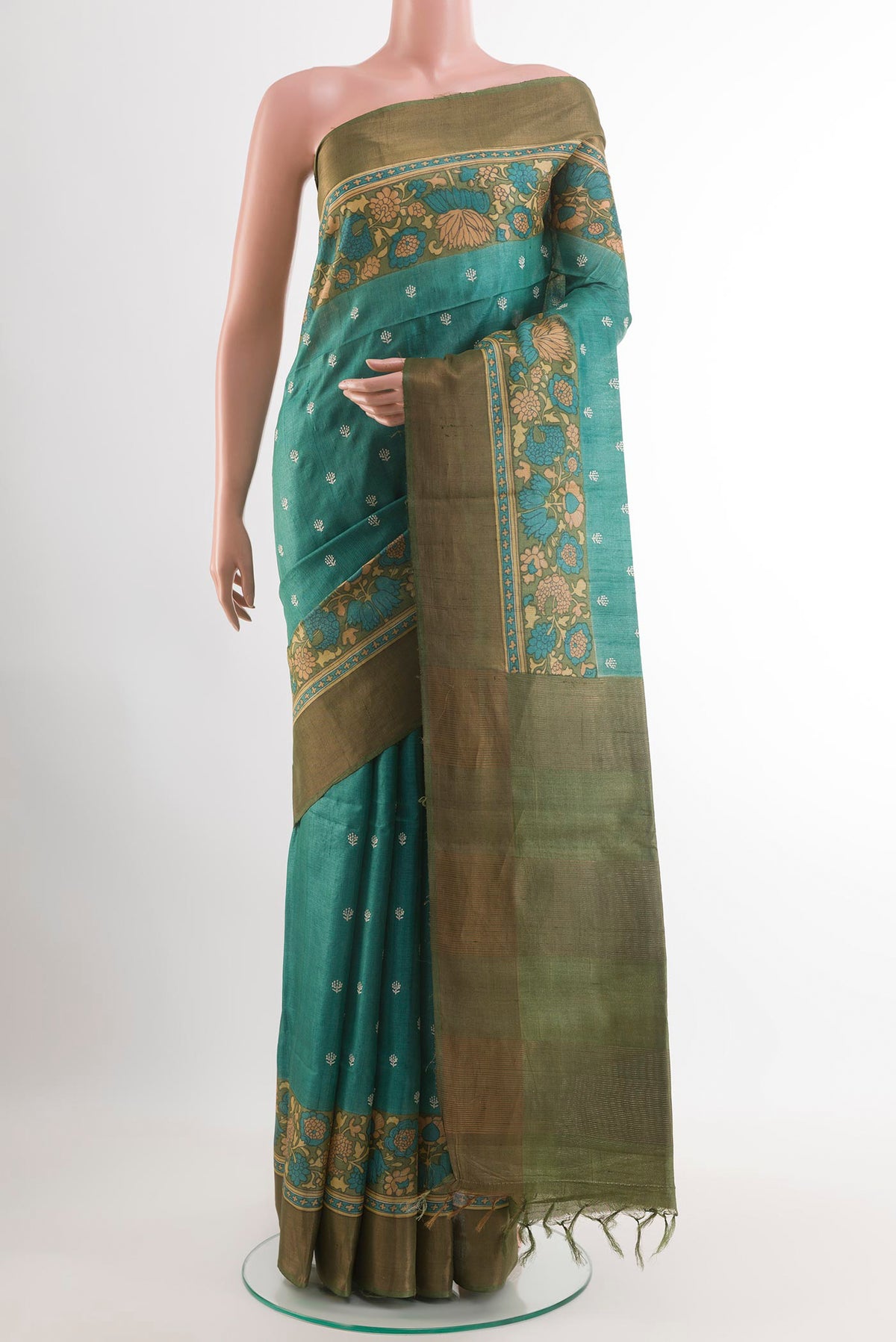 Sea Green Tussar Saree with Thread Butta on the body and Zari Border.  displayed on a mannequin