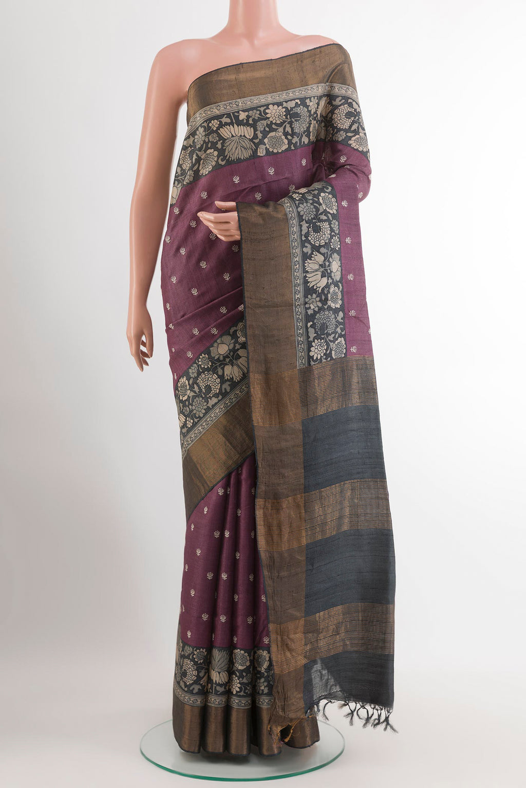 Purple Tussar Saree with Thread Butta on the body and Zari Border.  displayed on a mannequin