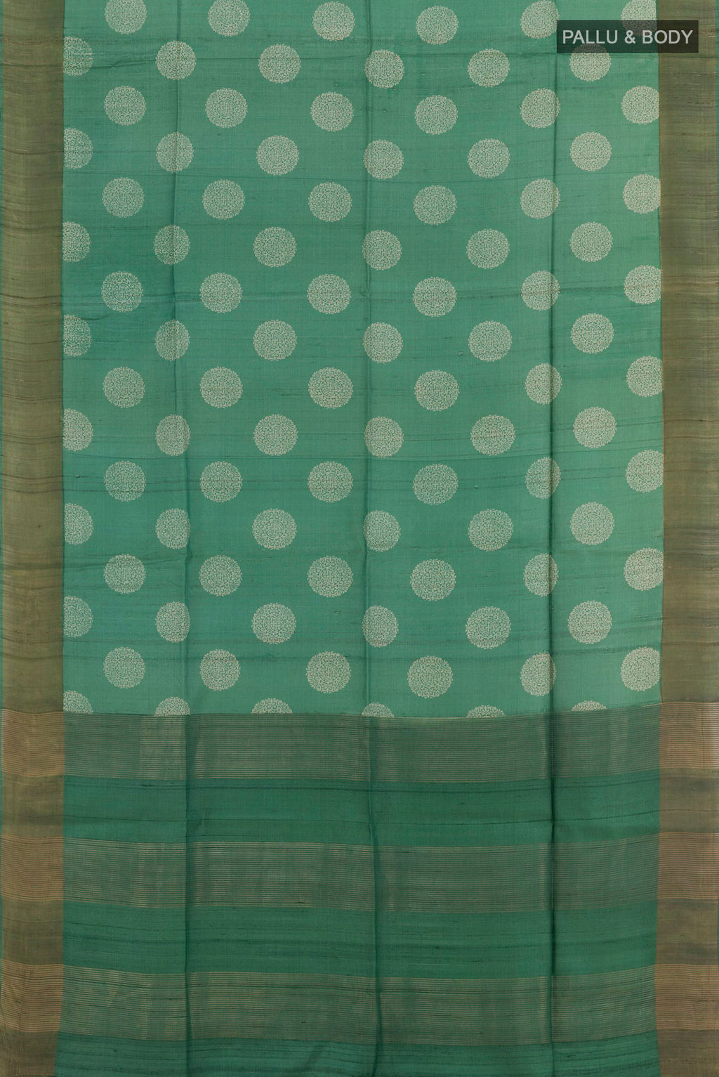 Flat view of Green Tussar Saree with Printed design on the body and Zari Border. 