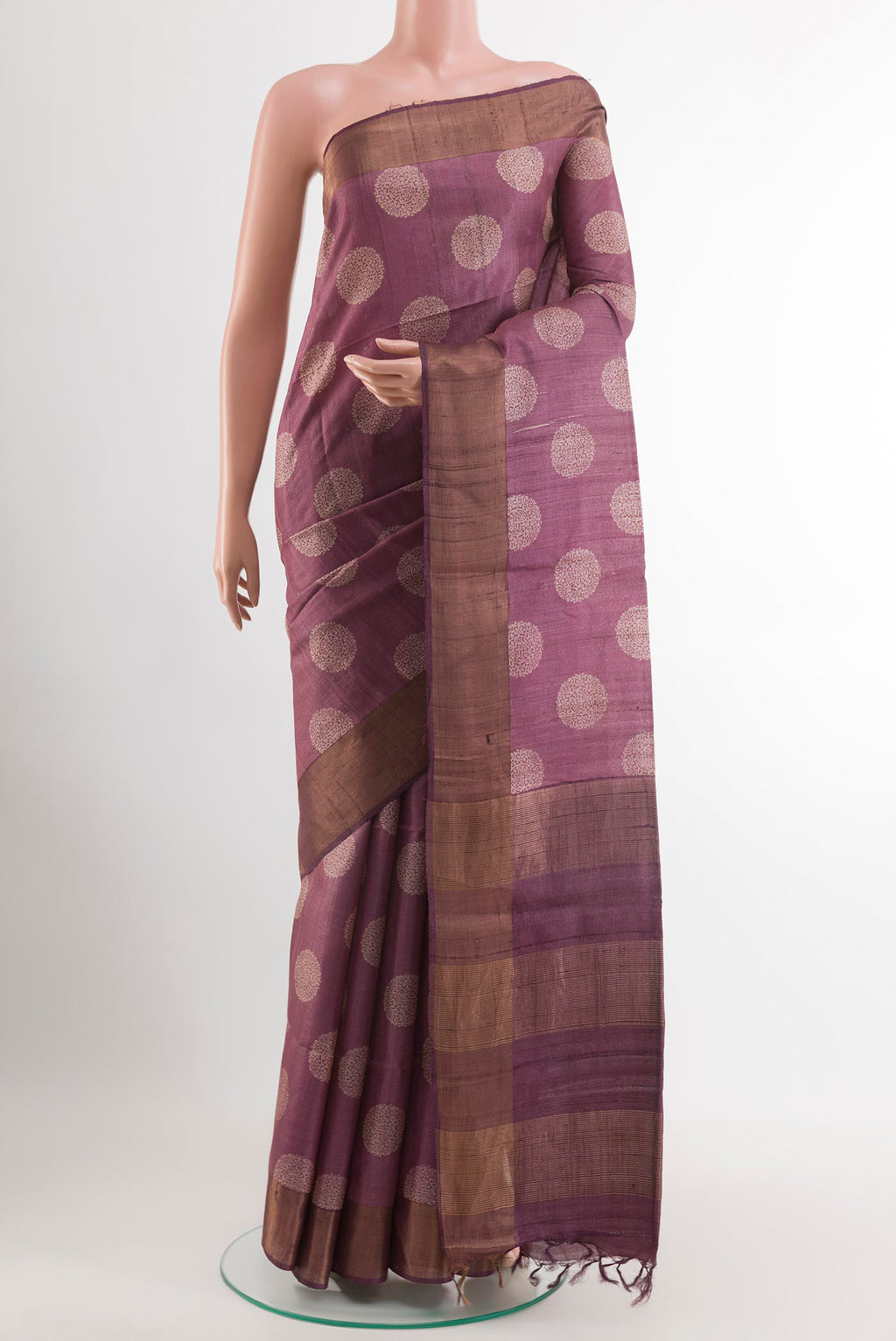 Purple Tussar Saree with Printed design on the body and Zari Border.  displayed on a mannequin