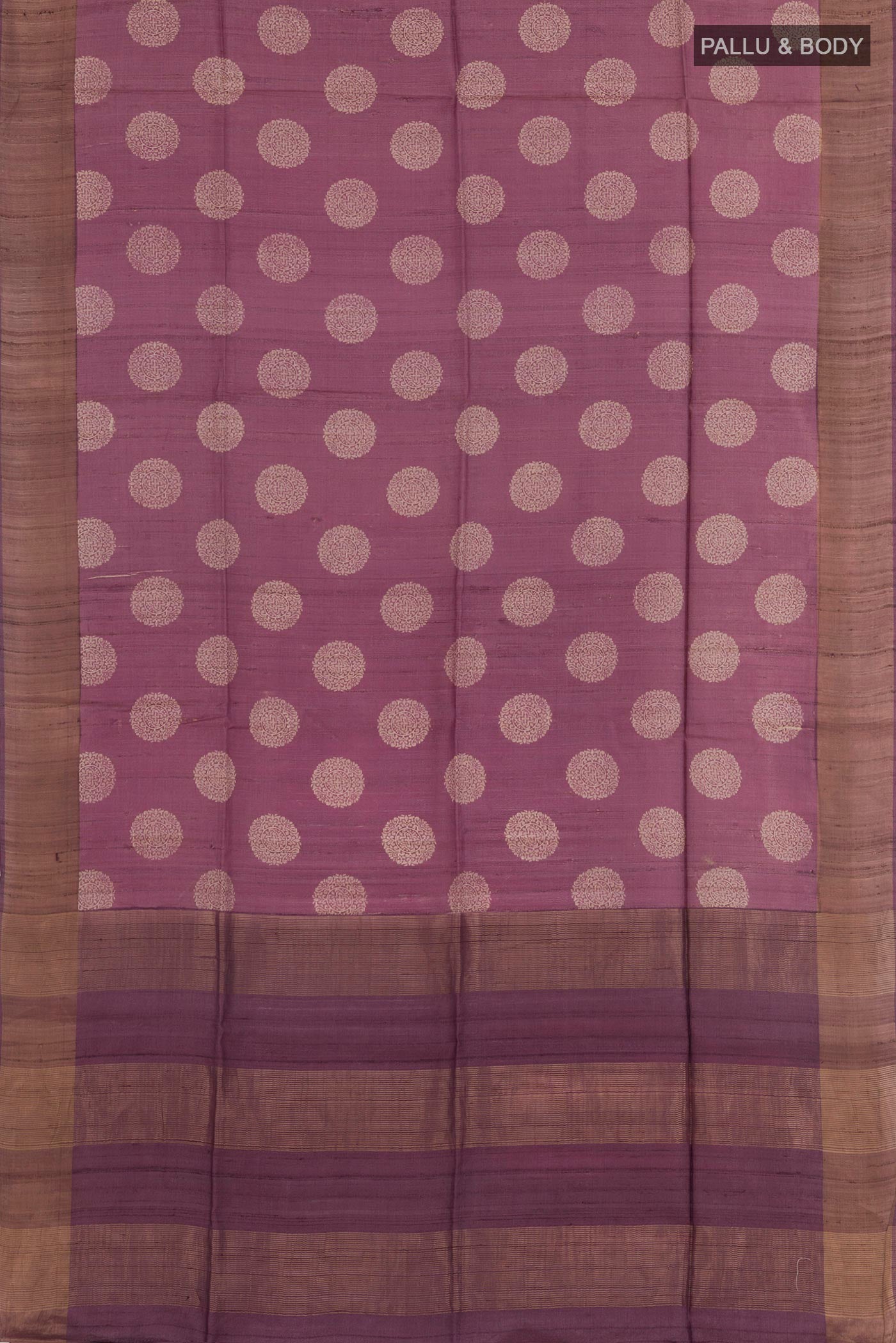 Flat view of Purple Tussar Saree with Printed design on the body and Zari Border. 
