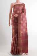 Maroon Tussar Saree with Printed design on the body and Zari Border.  displayed on a mannequin