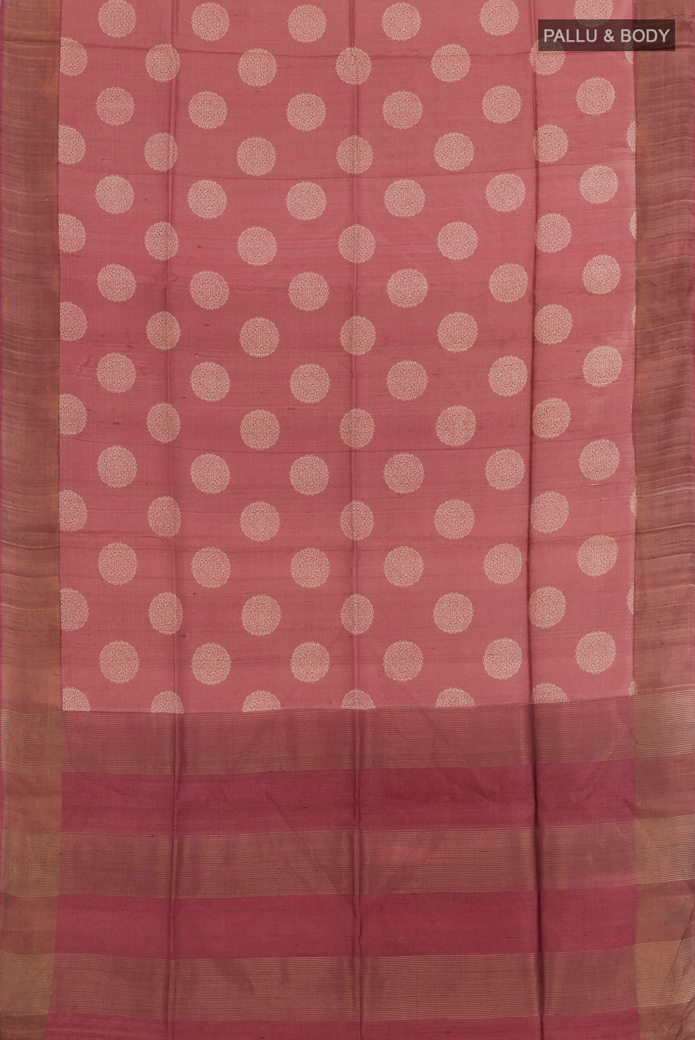Flat view of Maroon Tussar Saree with Printed design on the body and Zari Border. 
