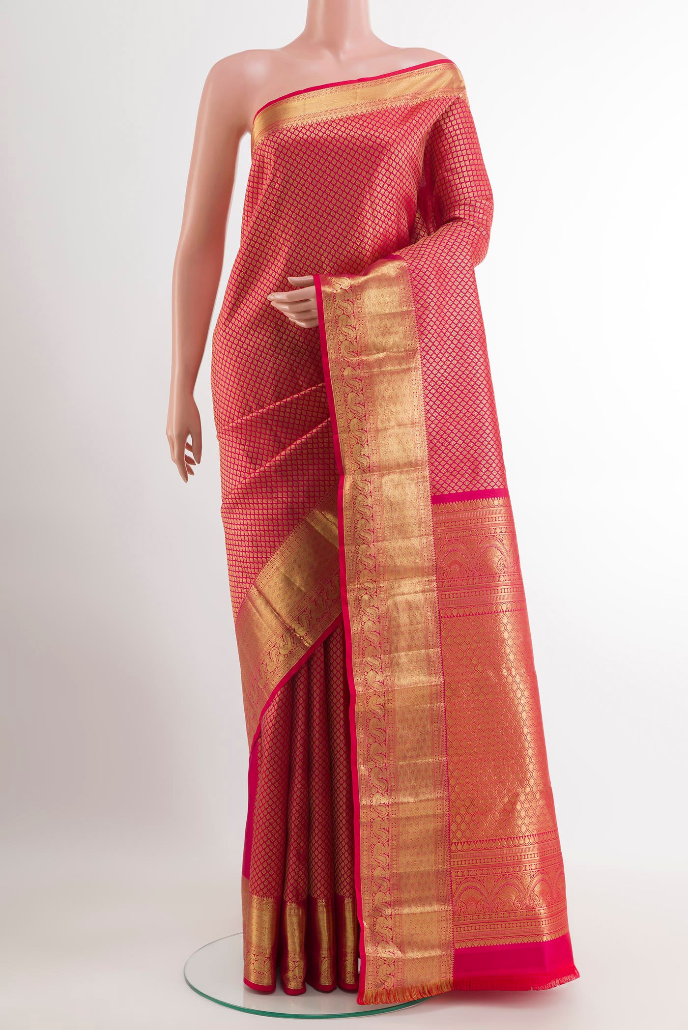 Red Kanchipuram Silk Saree with Zari Brocade on the body and Zari Border.  displayed on a mannequin
