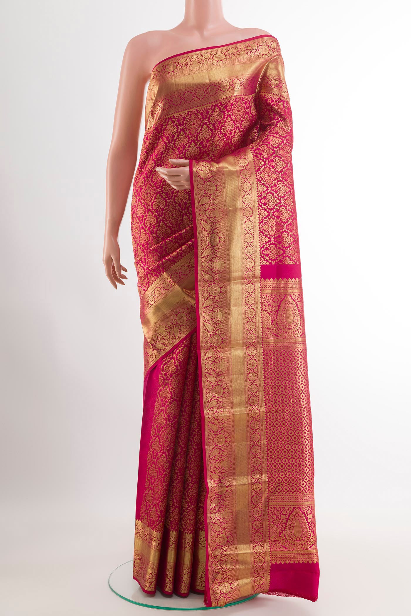 Rani Pink Kanchipuram Silk Saree with Zari Brocade on the body and Zari Border.  displayed on a mannequin