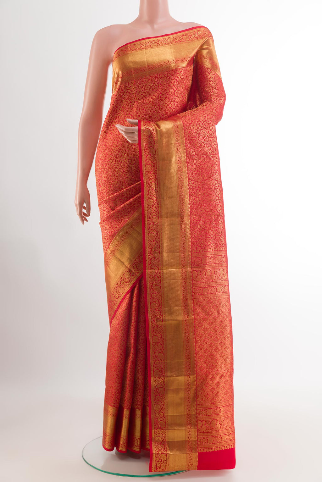 Red Kanchipuram Silk Saree with Zari Brocade on the body and Zari Border.  displayed on a mannequin