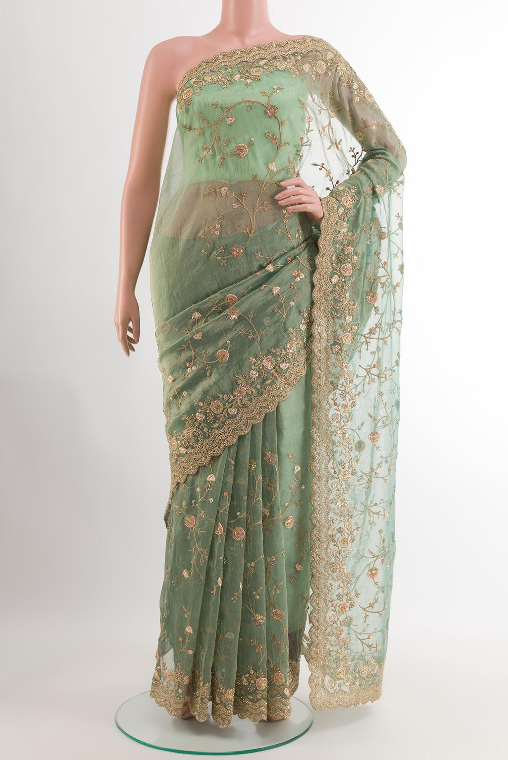 Sea Green Blended Art Silk Saree with Embroidery on the body and Embroidery Border.  displayed on a mannequin