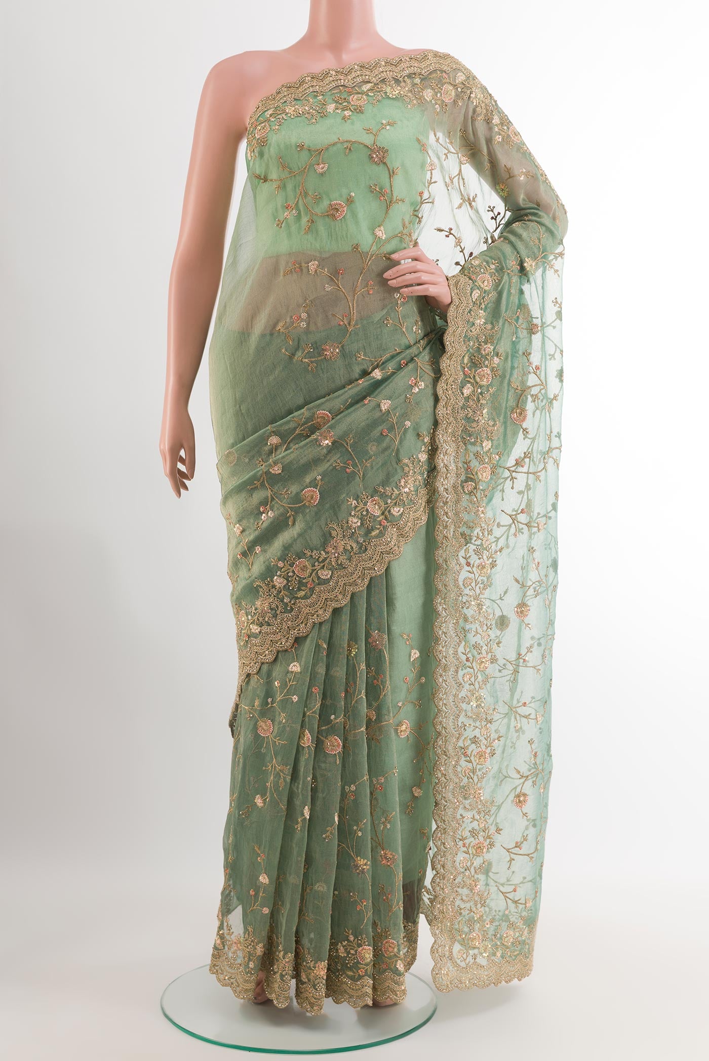 Sea Green Blended Art Silk Saree with Embroidery on the body and Embroidery Border.  displayed on a mannequin