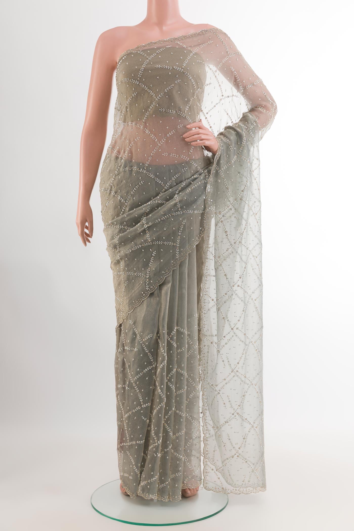 Grey Blended Art Silk Saree with Embroidery on the body and Embroidery Border.  displayed on a mannequin