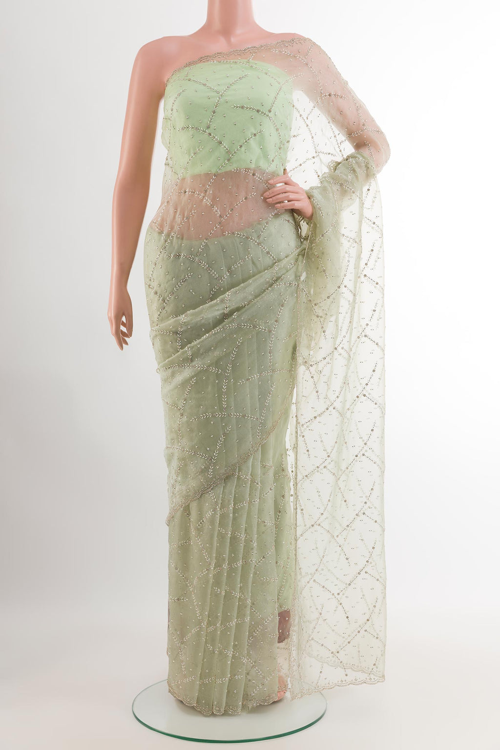 Green Blended Art Silk Saree with Embroidery on the body and Embroidery Border.  displayed on a mannequin