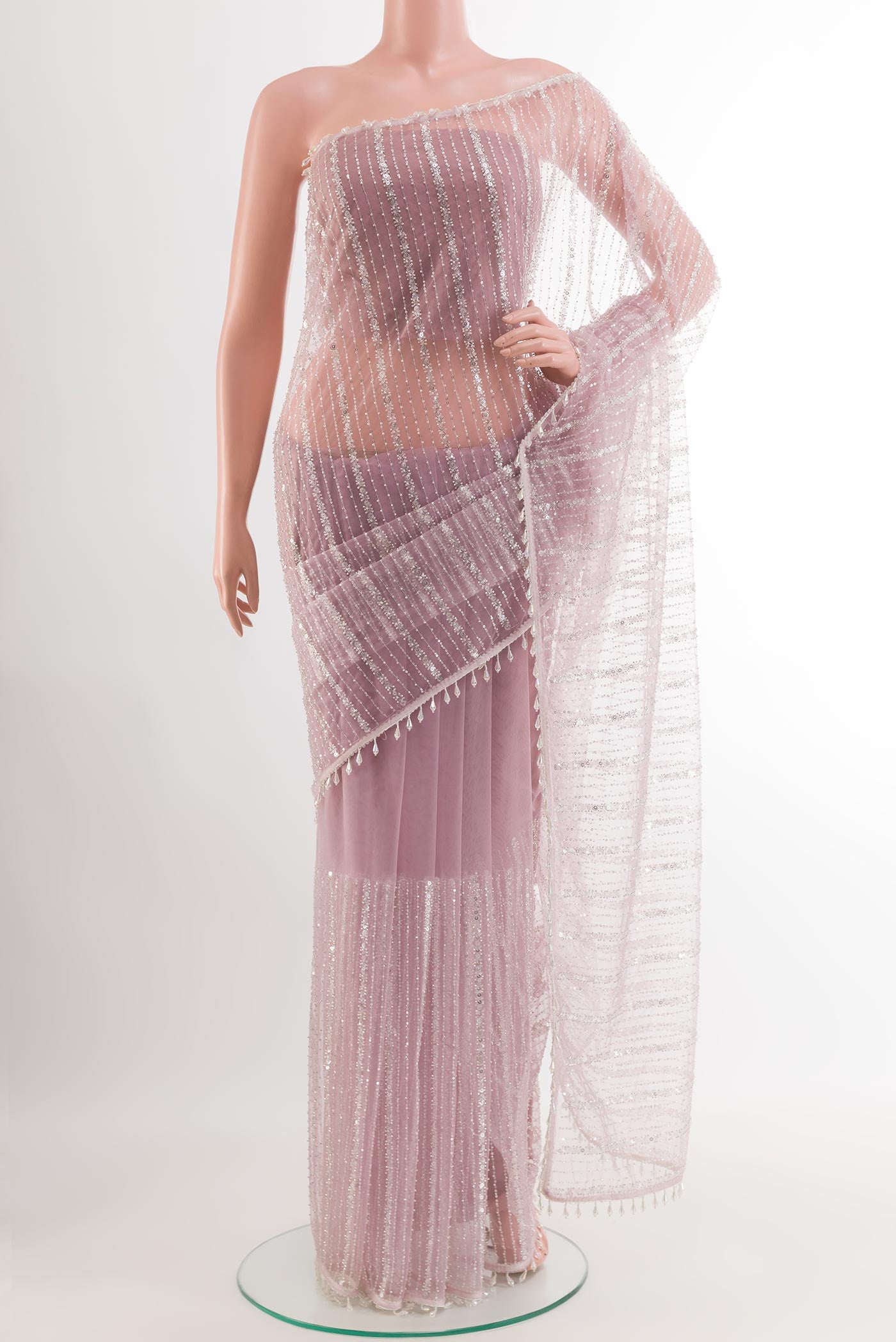 Lavender Blended Art Silk Saree with Embroidery on the body and Embroidery Border.  displayed on a mannequin