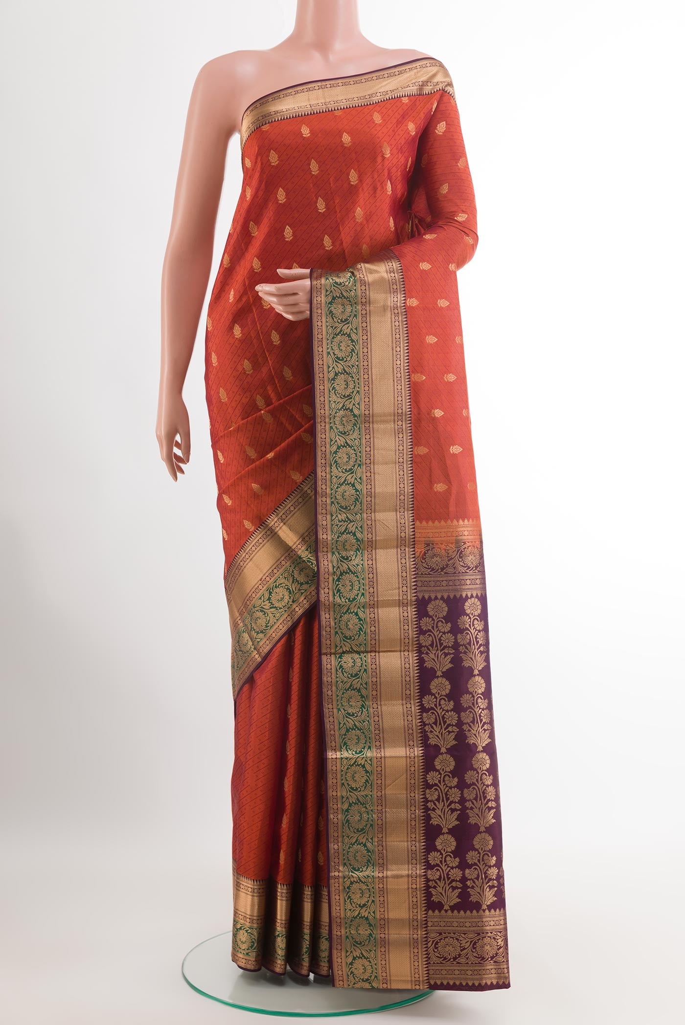Brick Orange Kanchipuram Silk Saree with Jacquard With Zari Butta on the body and Zari Border.  displayed on a mannequin