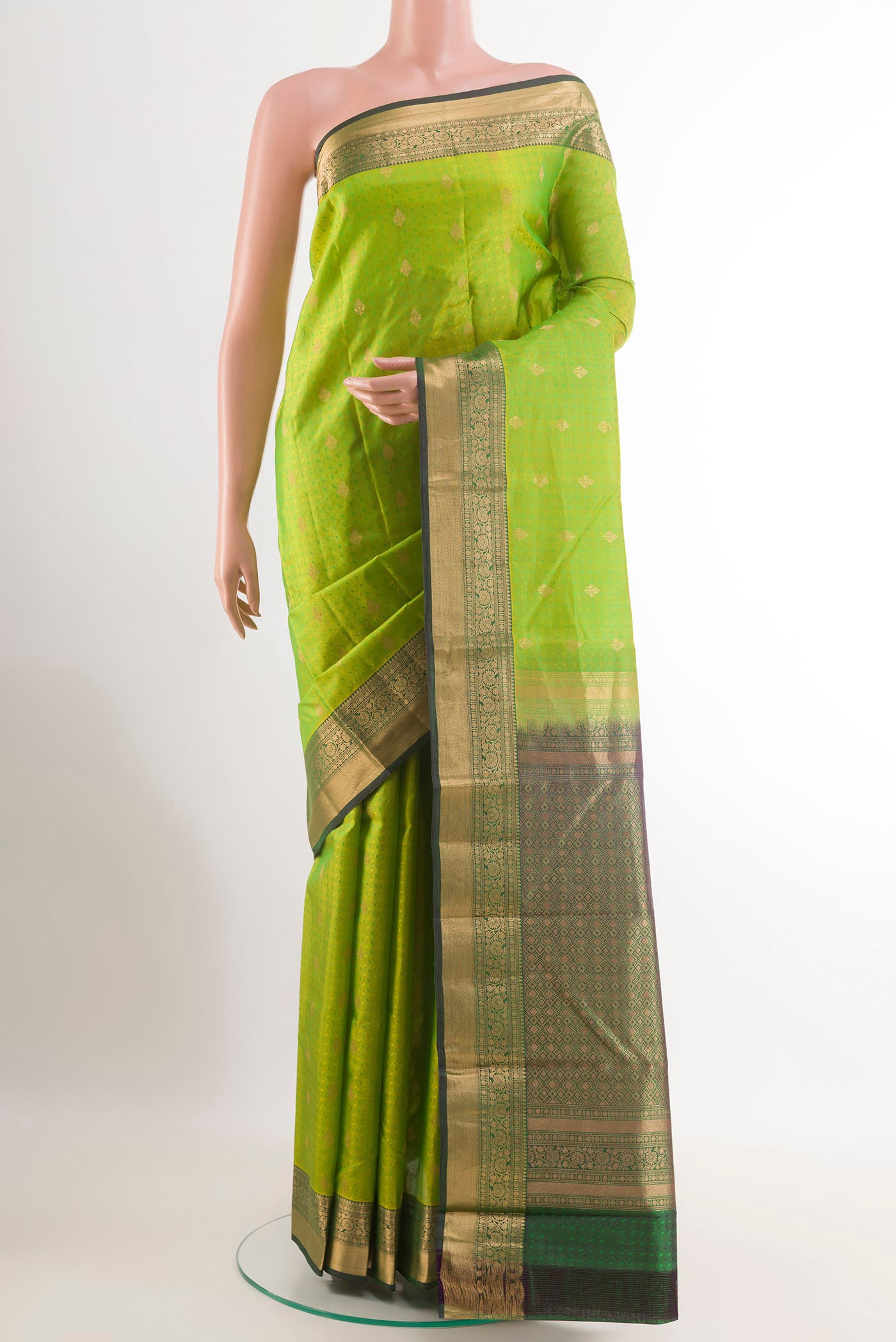 Light Green Kanchipuram Silk Saree with Jacquard With Zari Butta on the body and Zari Border.  displayed on a mannequin