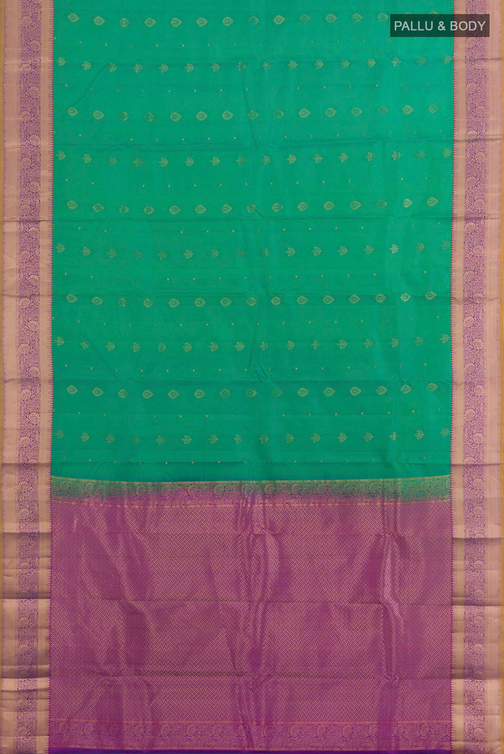 Flat view of Green Kanchipuram Silk Saree with Zari Butta on the body and Zari Border. 