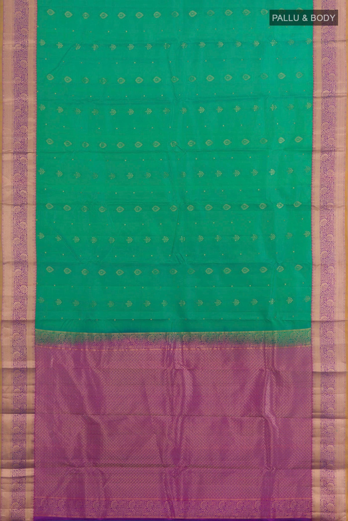 Flat view of Green Kanchipuram Silk Saree with Zari Butta on the body and Zari Border. 