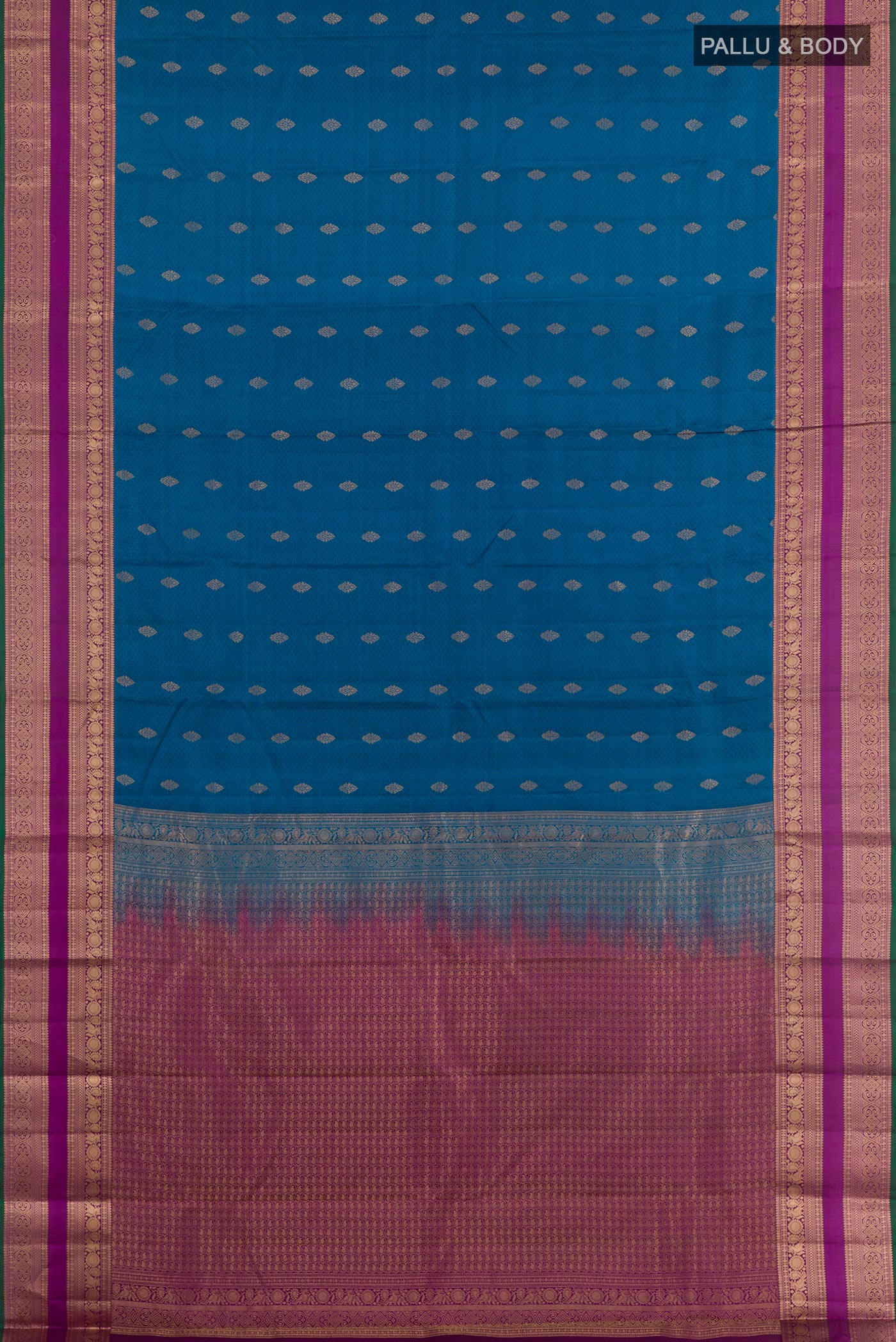 Flat view of Peacock Blue Kanchipuram Silk Saree with Jacquard With Zari Butta on the body and Zari Border. 