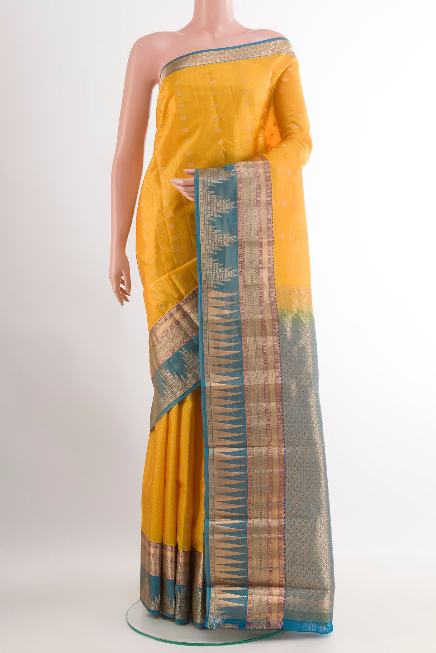 Yellow Kanchipuram Silk Saree with Jacquard With Zari Butta on the body and Zari Border.  displayed on a mannequin