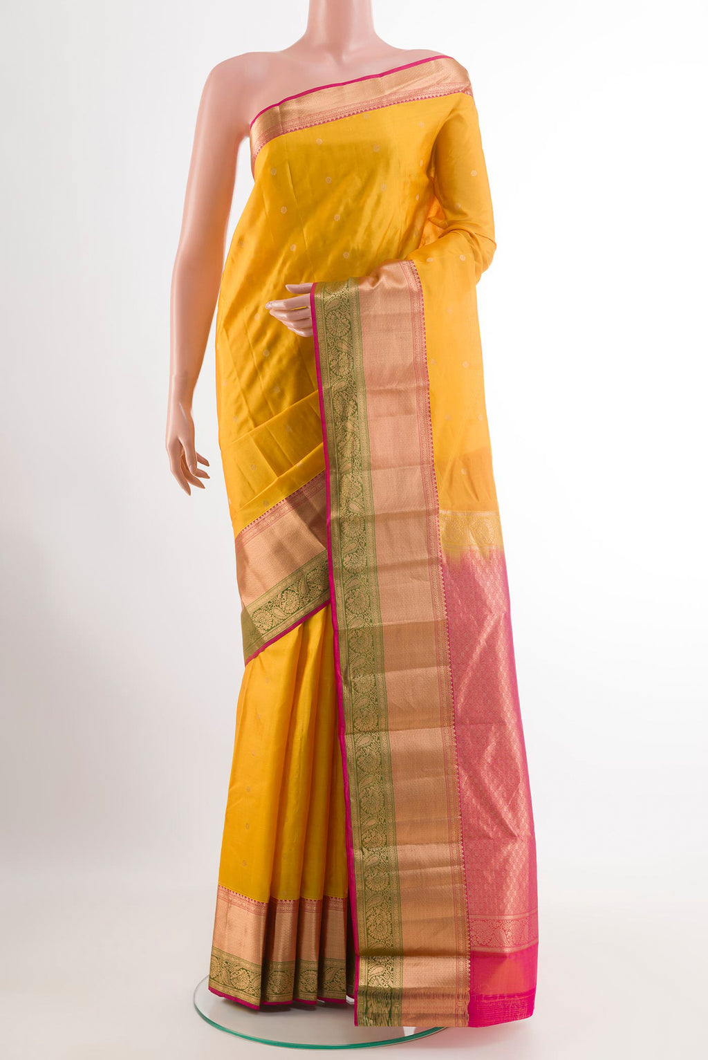 Yellow Kanchipuram Silk Saree with Zari Butta on the body and Zari Border.  displayed on a mannequin