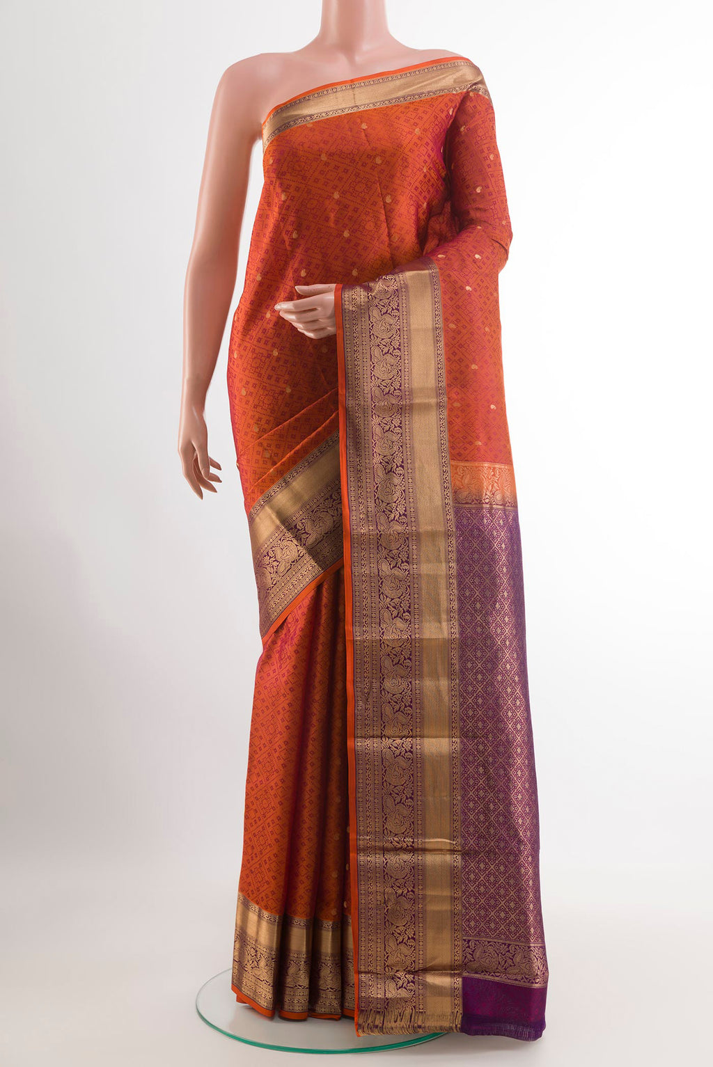 Brick Orange Kanchipuram Silk Saree with Jacquard With Zari Butta on the body and Zari Border.  displayed on a mannequin