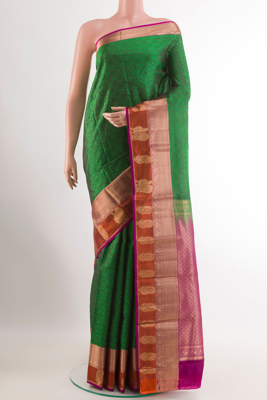 Green Kanchipuram Silk Saree with Jacquard With Zari Butta on the body and Zari Border.  displayed on a mannequin