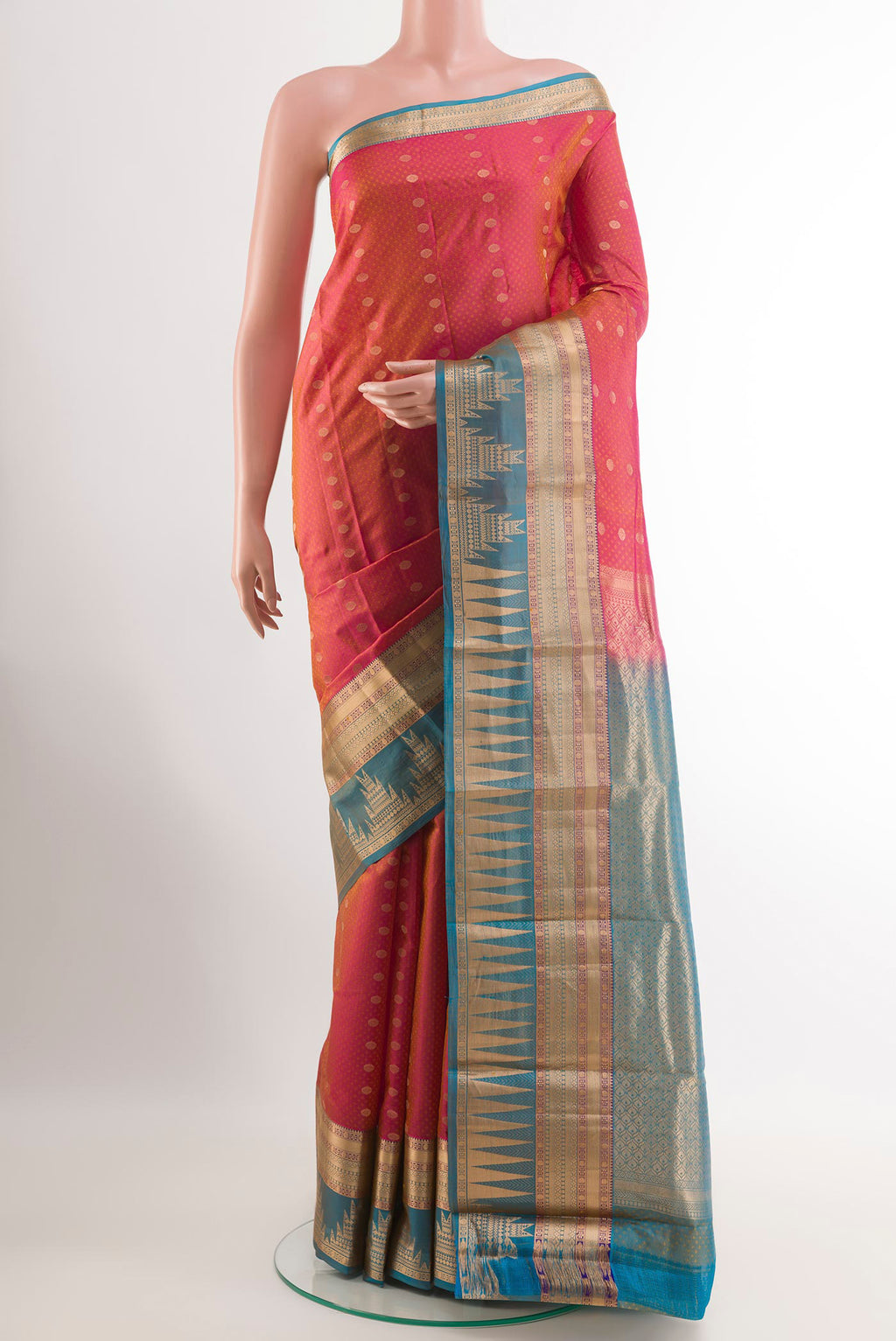Peach Kanchipuram Silk Saree with Jacquard With Zari Butta on the body and Zari Border.  displayed on a mannequin