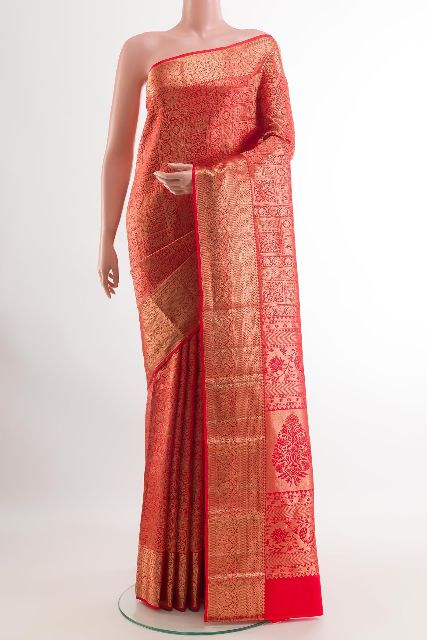 Red Kanchipuram Silk Saree with Zari Brocade on the body and Zari Border.  displayed on a mannequin