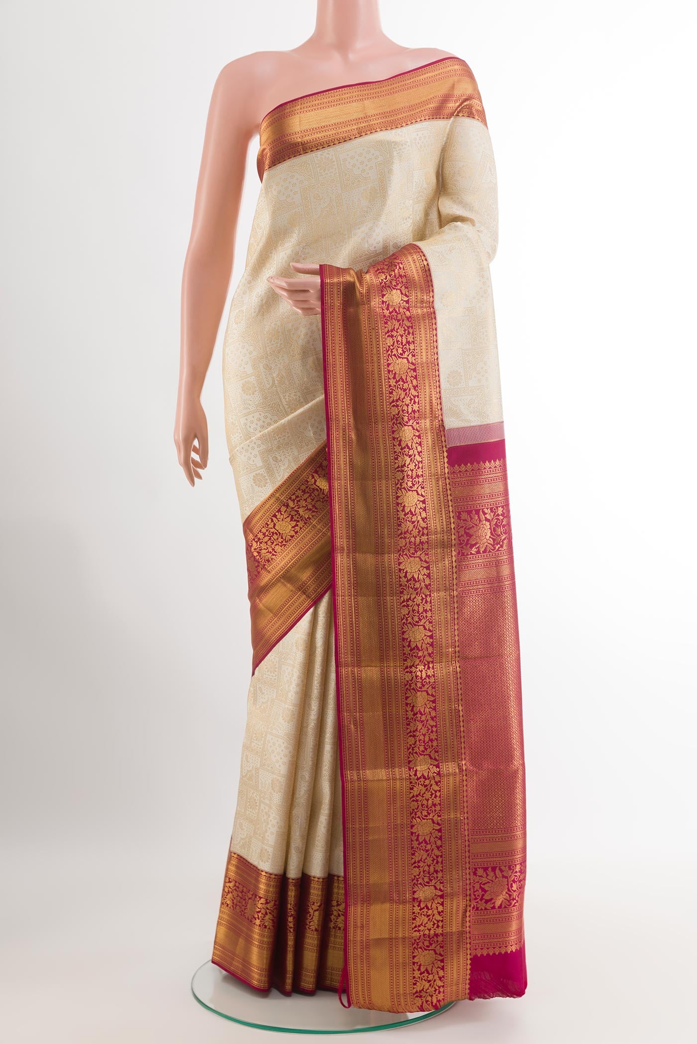 Off White Kanjivaram Silk Saree with Zari Brocade on the body and Zari Border.  displayed on a mannequin