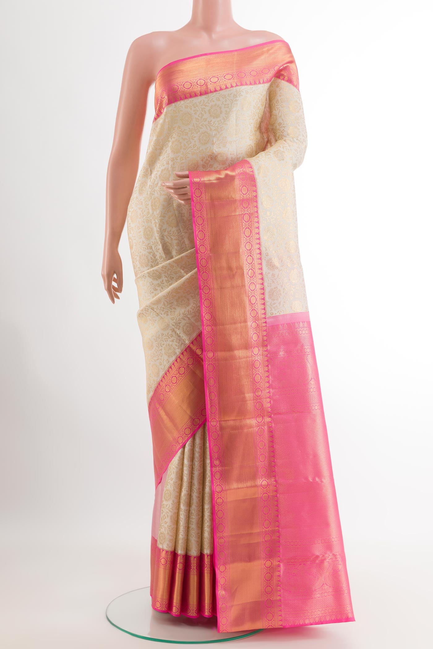 Off White Kanjivaram Silk Saree with Zari Brocade on the body and Zari Border.  displayed on a mannequin