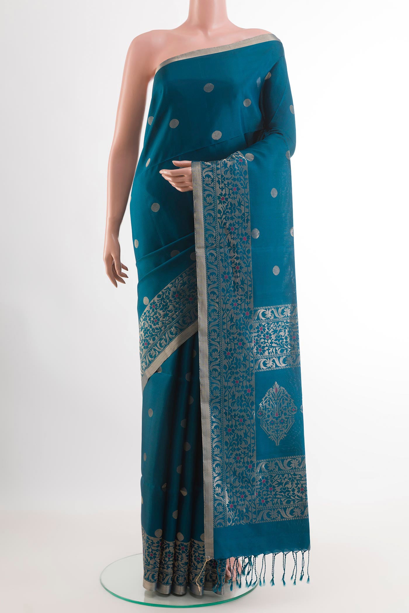 Blue Soft Silk Saree with Zari Butta on the body and Zari Border.  displayed on a mannequin