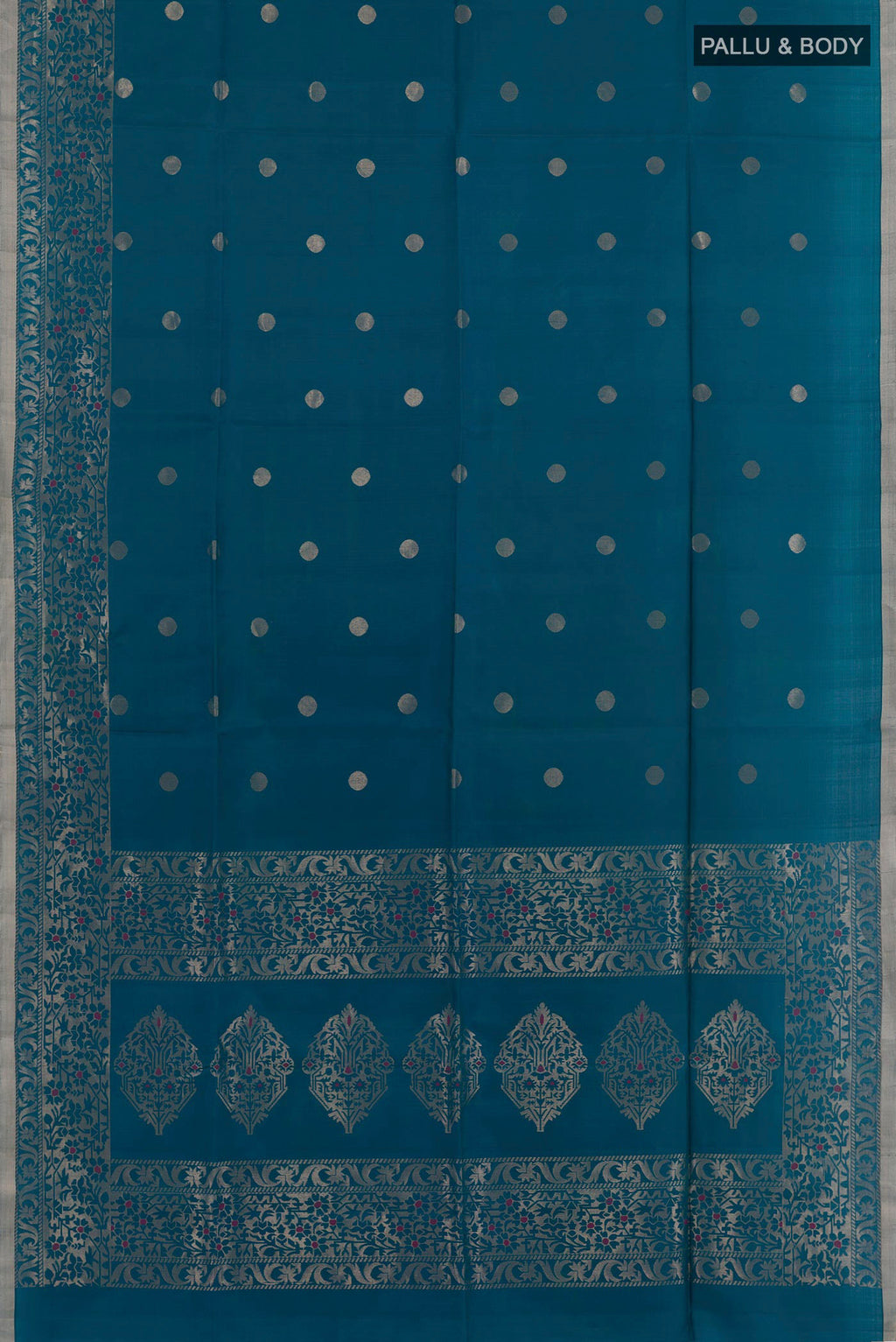 Flat view of Blue Soft Silk Saree with Zari Butta on the body and Zari Border. 