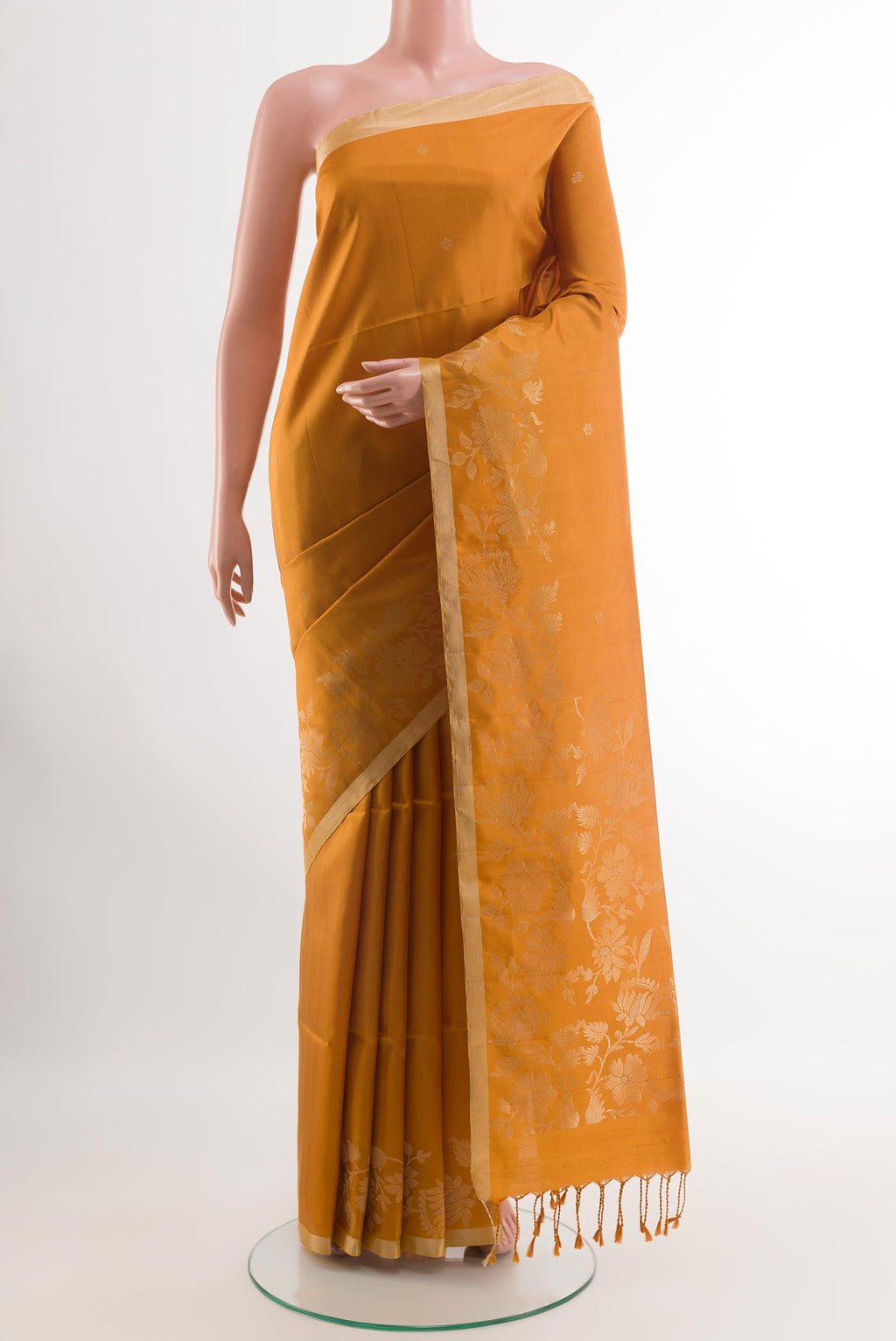 Yellow Soft Silk Saree with Zari Butta on the body and Zari Border.  displayed on a mannequin