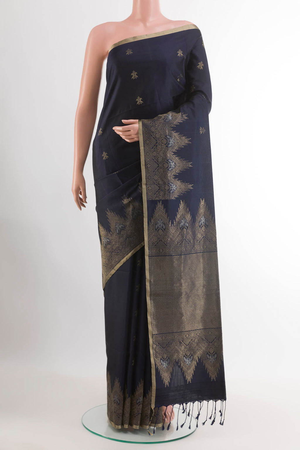Dark Blue Soft Silk Saree with Zari Butta on the body and Zari Border.  displayed on a mannequin