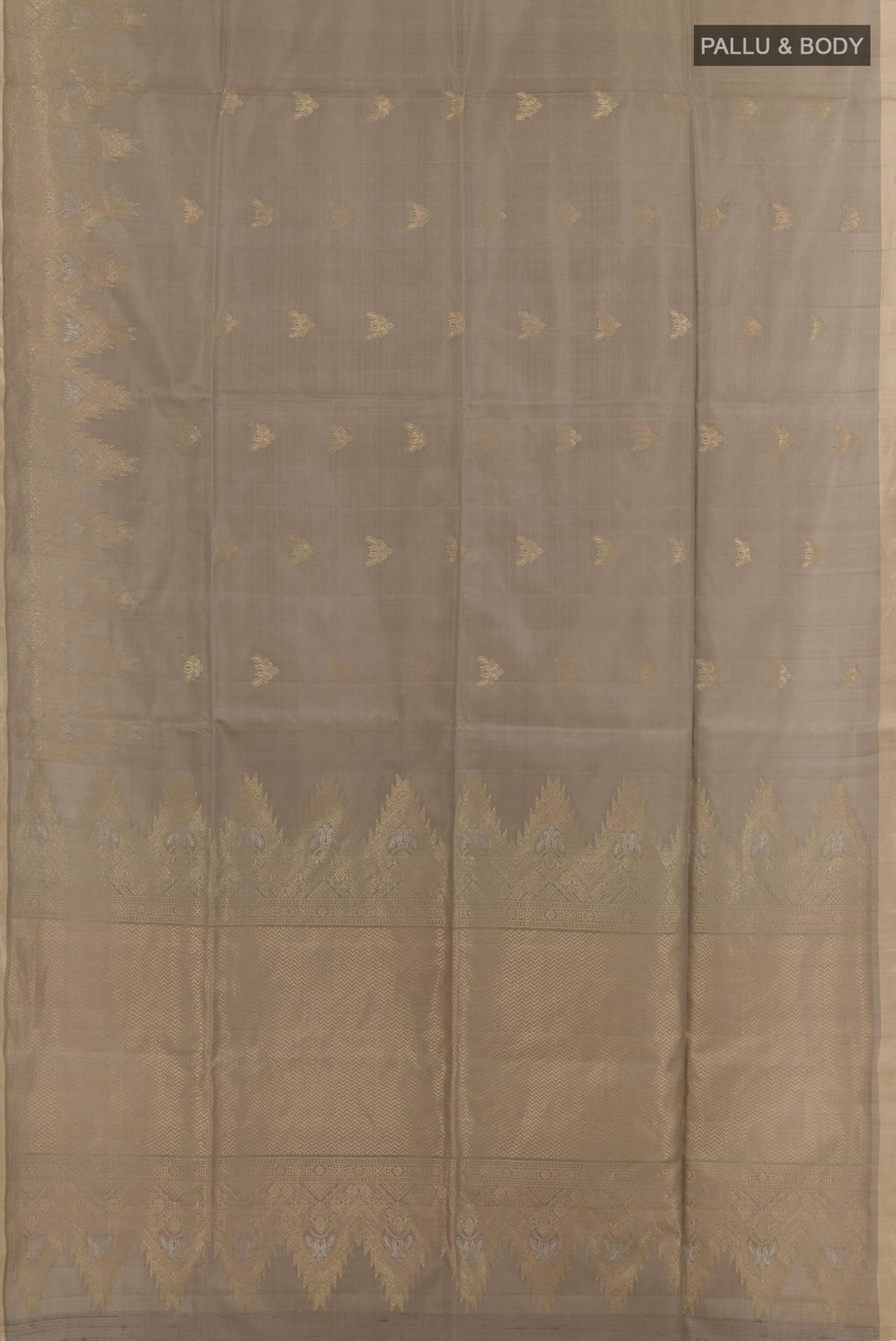 Flat view of Beige Soft Silk Saree with Zari Butta on the body and Zari Border. 