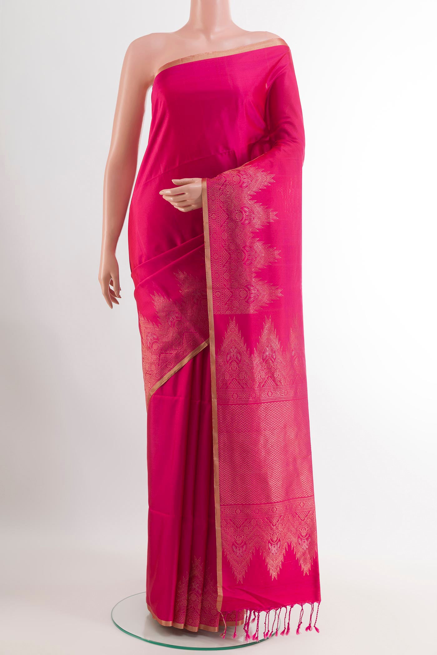 Pink Soft Silk Saree with Zari Butta on the body and Zari Border.  displayed on a mannequin