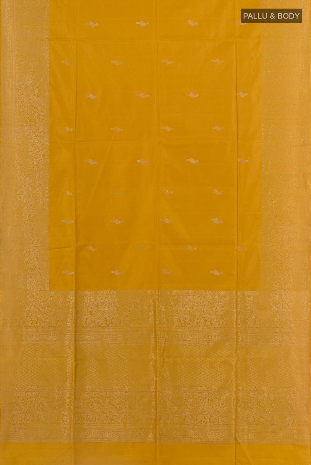Flat view of Mustard Soft Silk Saree with Zari Butta on the body and Zari Border. 