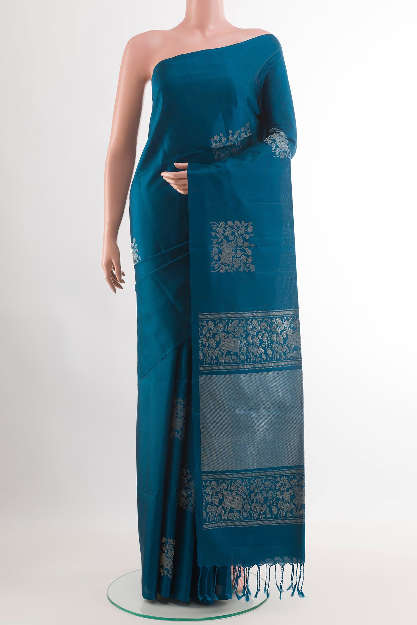 Blue Soft Silk Saree with Zari Butta on the body and Zari Border.  displayed on a mannequin