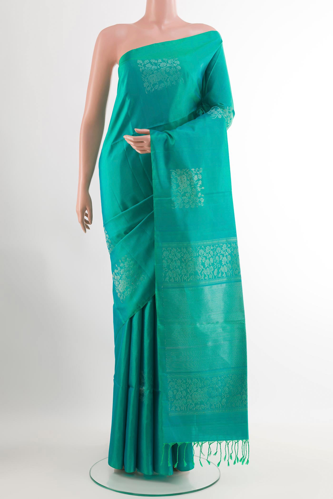 Sea Green Soft Silk Saree with Zari Butta on the body and Zari Border.  displayed on a mannequin