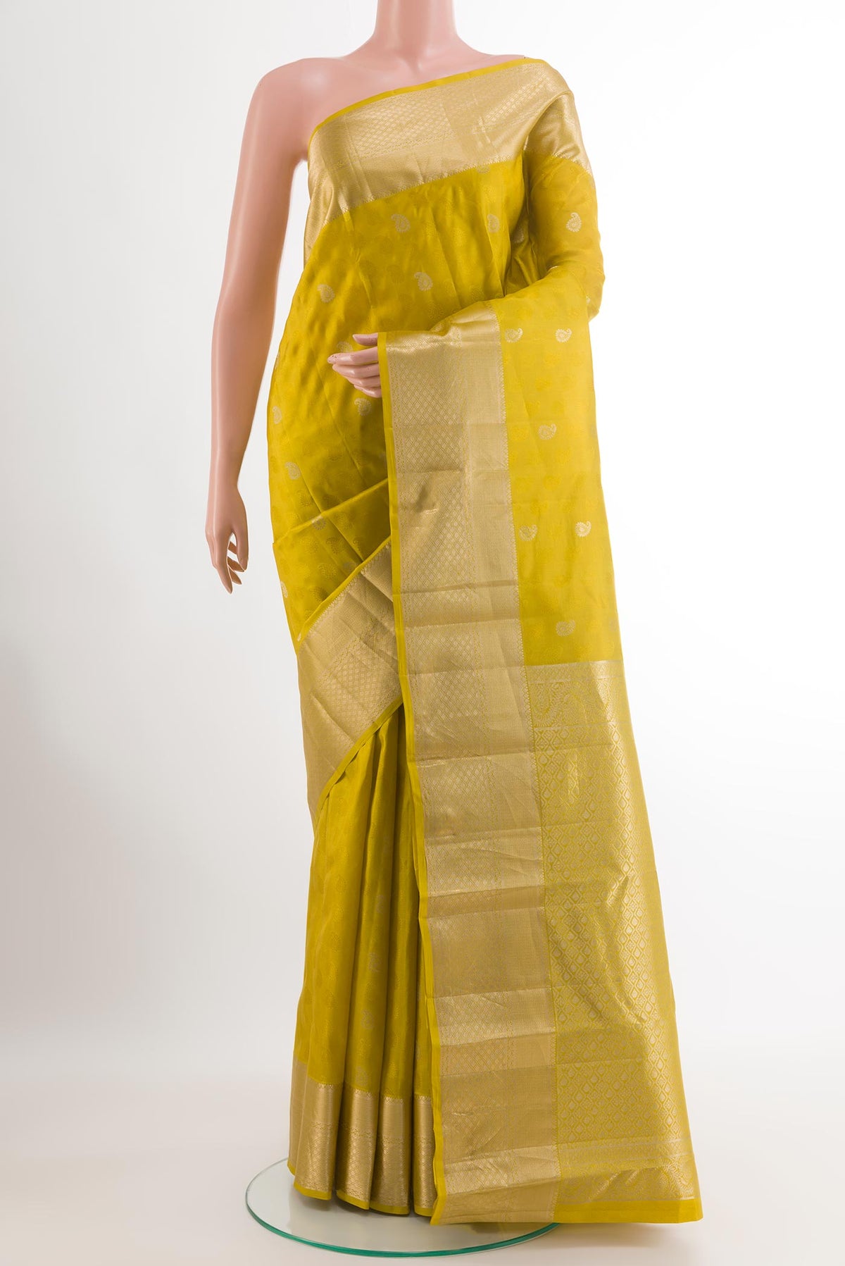 Light Green Kanchipuram Silk Saree with Jacquard With Zari Butta on the body and Zari Border.  displayed on a mannequin