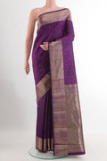 Purple Kanchipuram Silk Saree with Zari Butta on the body and Zari Border.  displayed on a mannequin