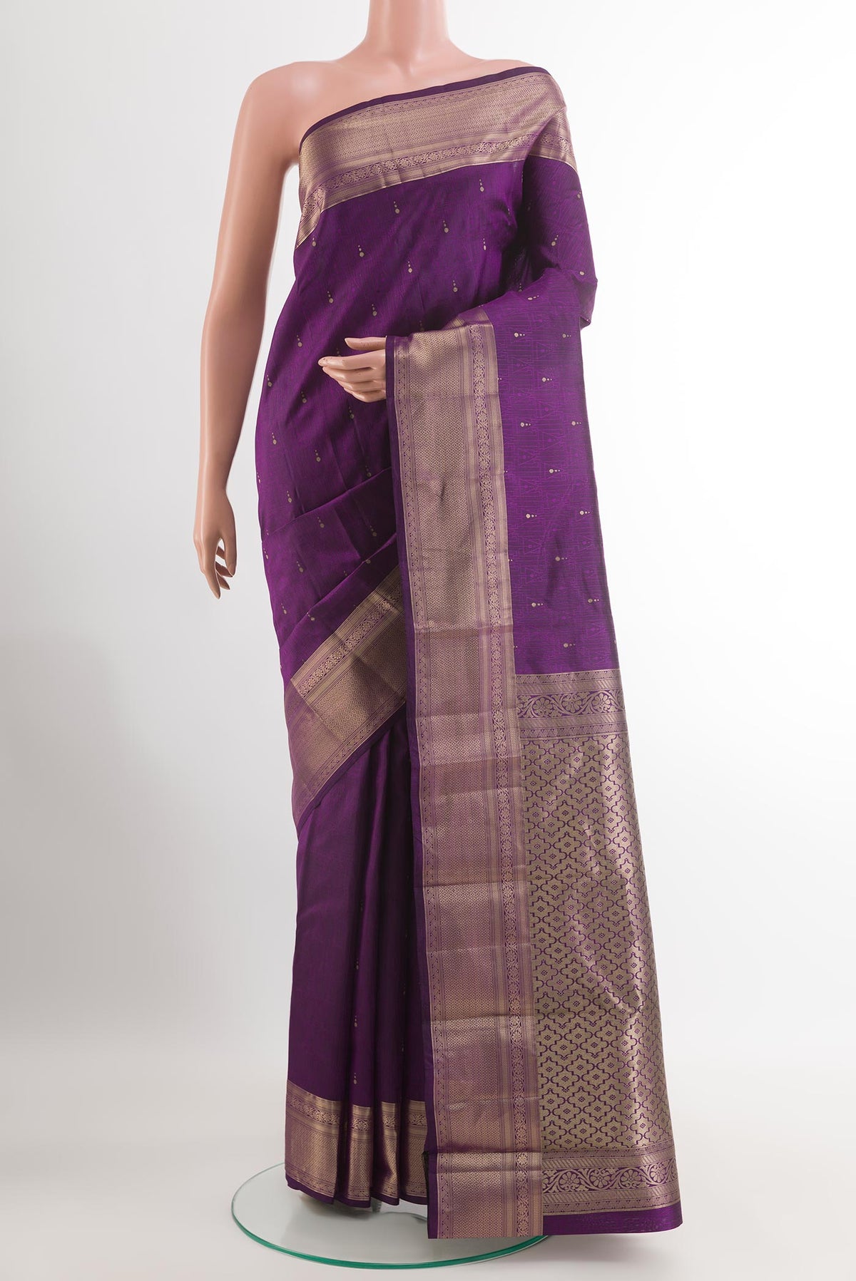 Purple Kanchipuram Silk Saree with Zari Butta on the body and Zari Border.  displayed on a mannequin