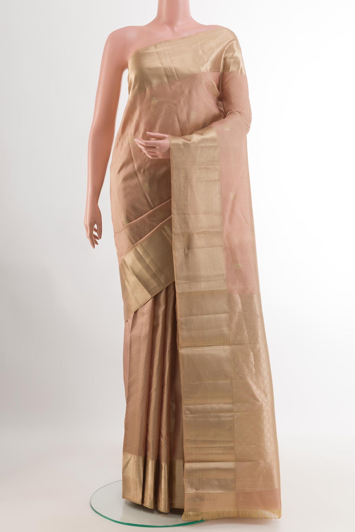 Beige Kanchipuram Silk Saree with Jacquard With Zari Butta on the body and Zari Border.  displayed on a mannequin