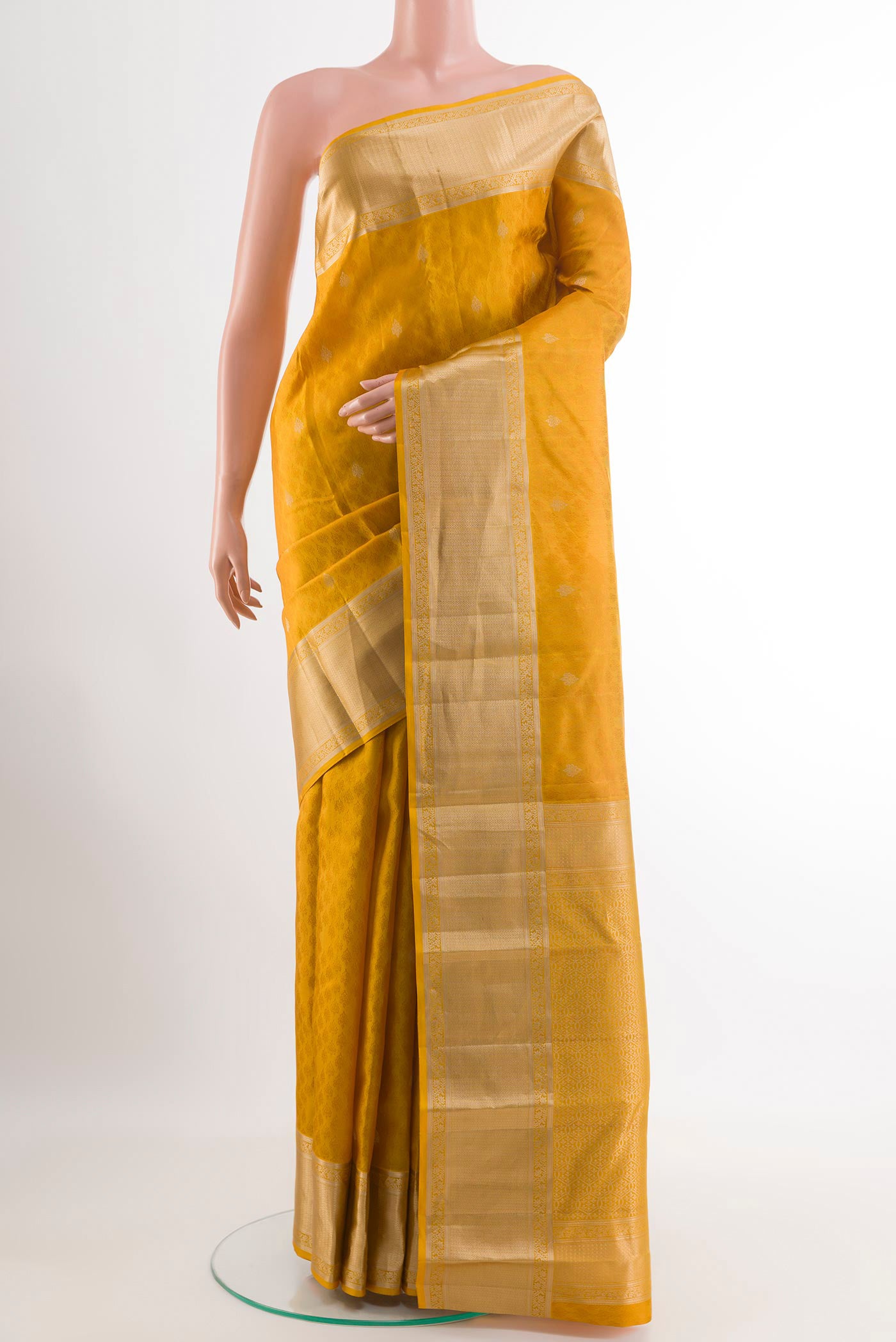 Yellow Kanchipuram Silk Saree with Jacquard With Zari Butta on the body and Zari Border.  displayed on a mannequin