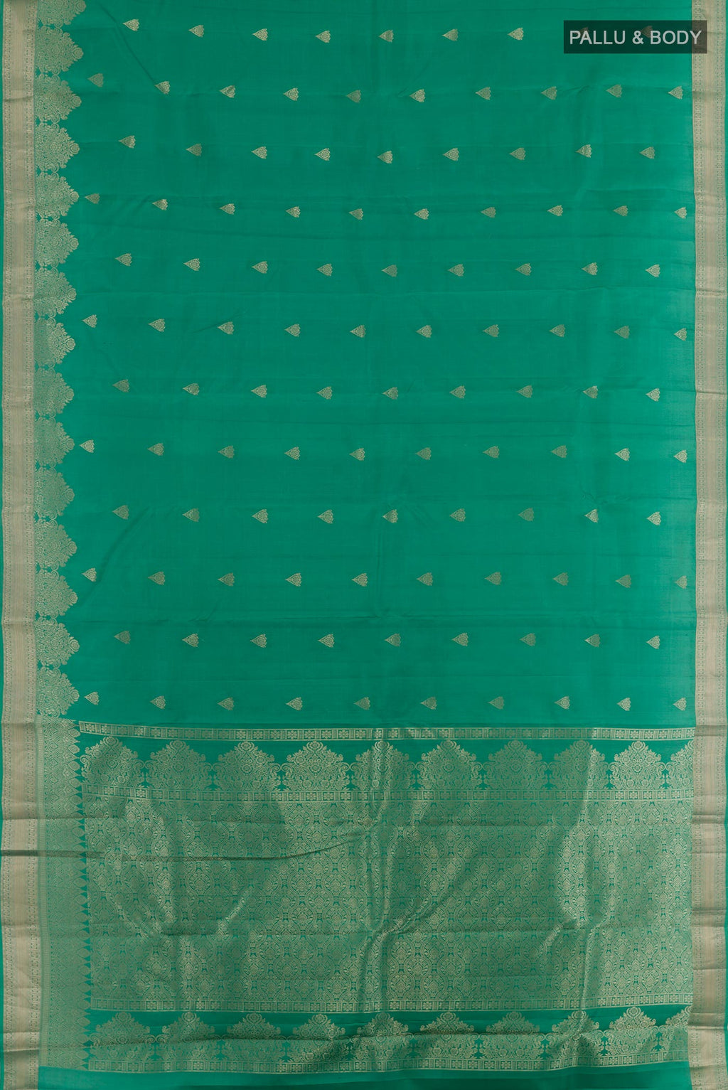 Flat view of Green Kanjivaram Silk Saree with Zari Butta on the body and Zari Border. 