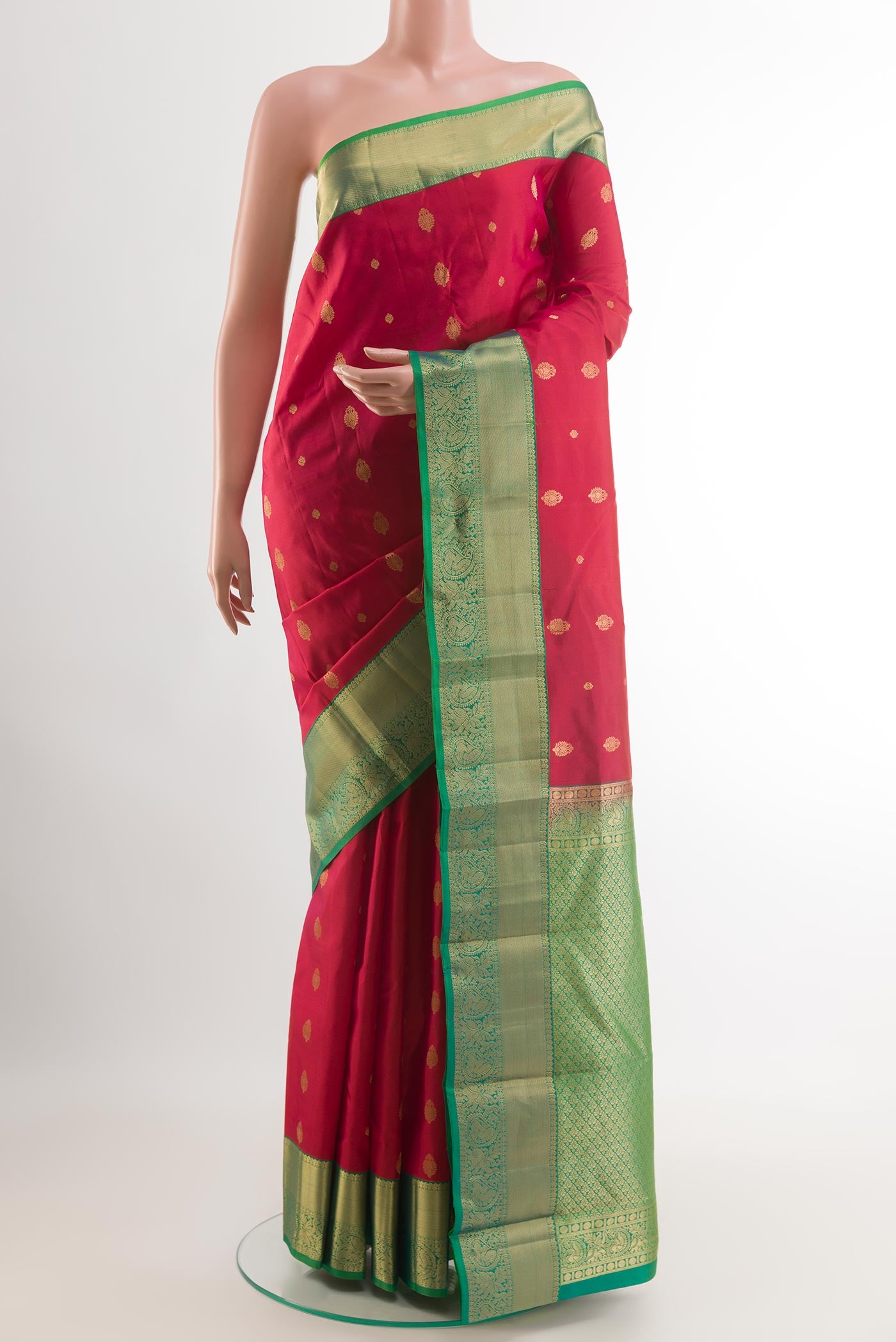 Red Kanchipuram Silk Saree with Zari Butta on the body and Zari Border.  displayed on a mannequin