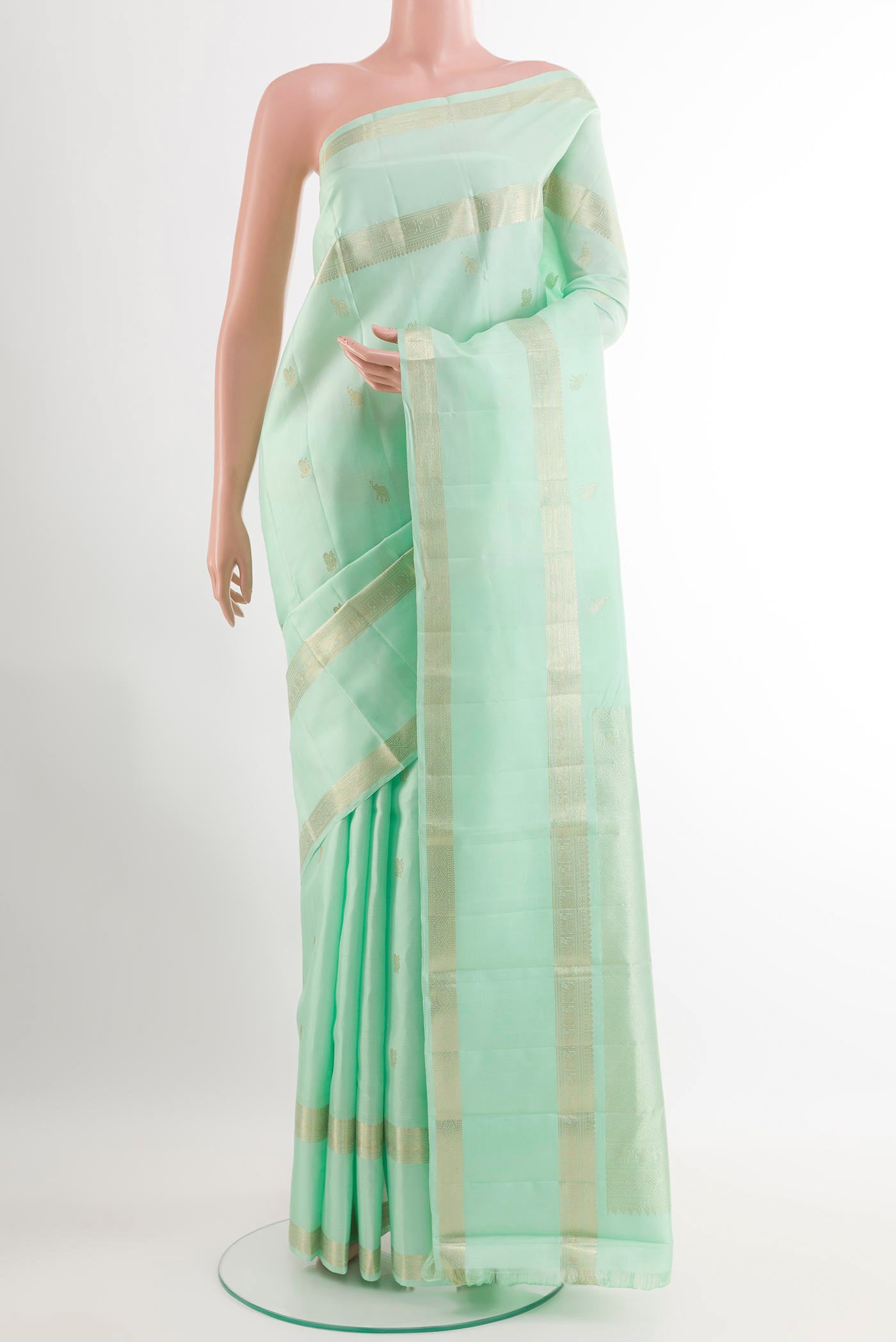 Sea Green Kanchipuram Silk Saree with Zari Butta on the body and Zari Border.  displayed on a mannequin