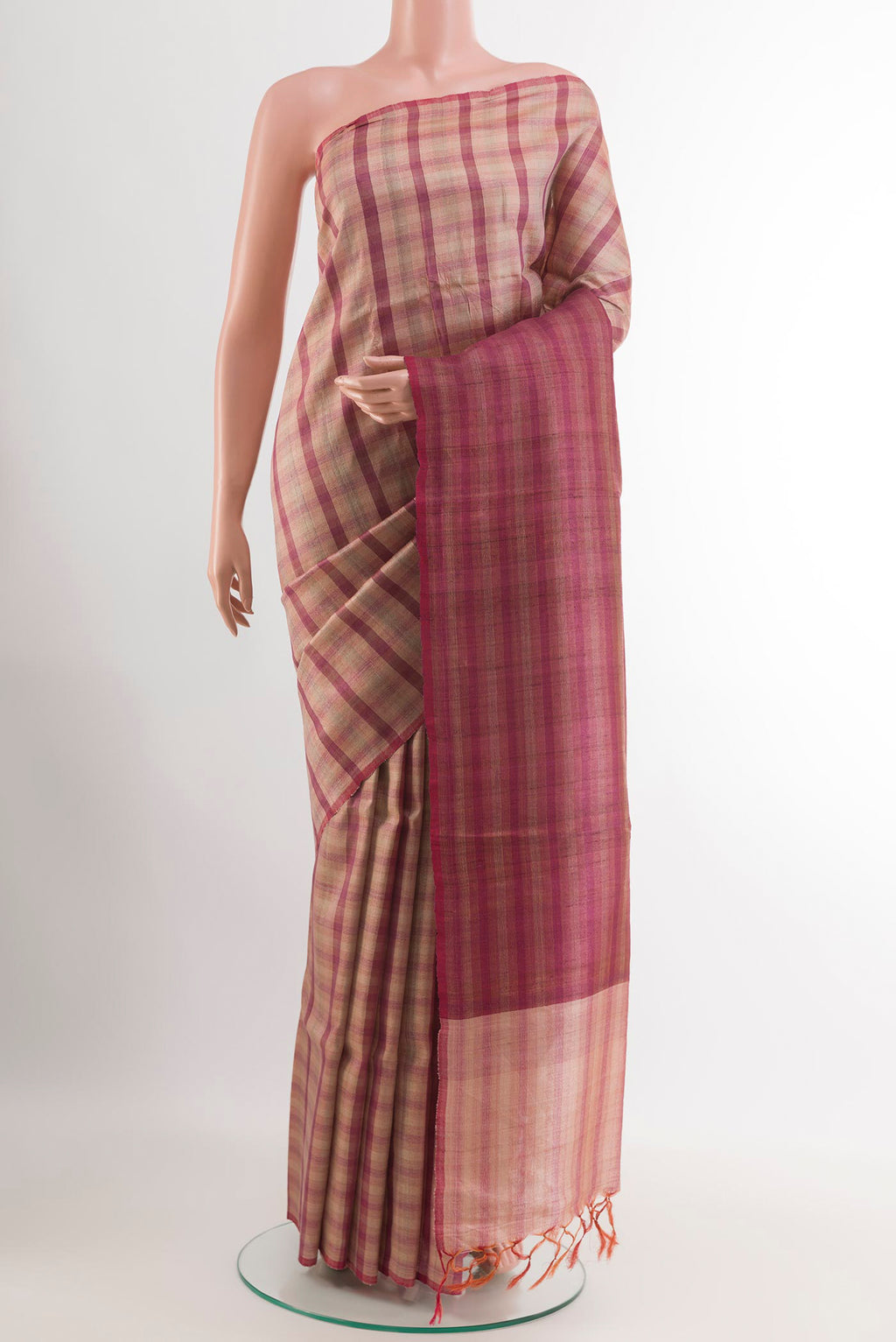Pink Tussar Saree with Printed design on the body and Zari Border.  displayed on a mannequin